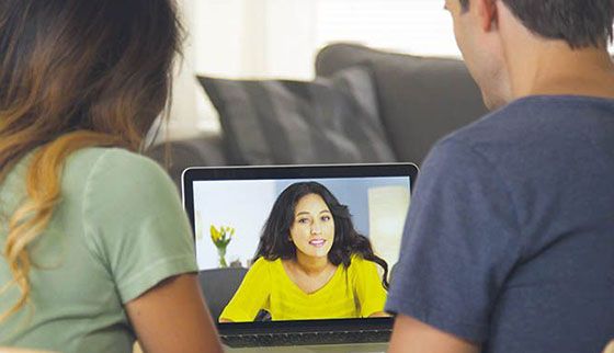couple with relationship therapist in an online counselling session