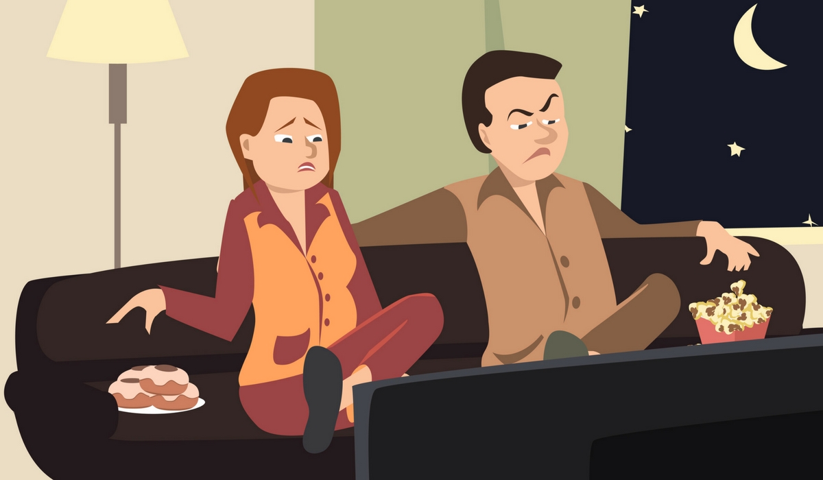 angry couple watching television