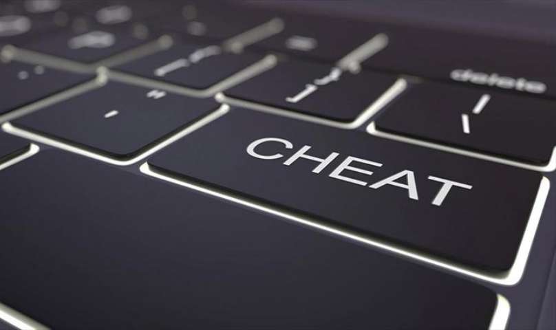 computer keyboard with the word CHEAT on a key