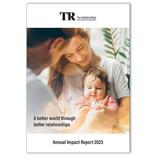 Cover of 2023 Annual Impact Report showing a couple with their baby
